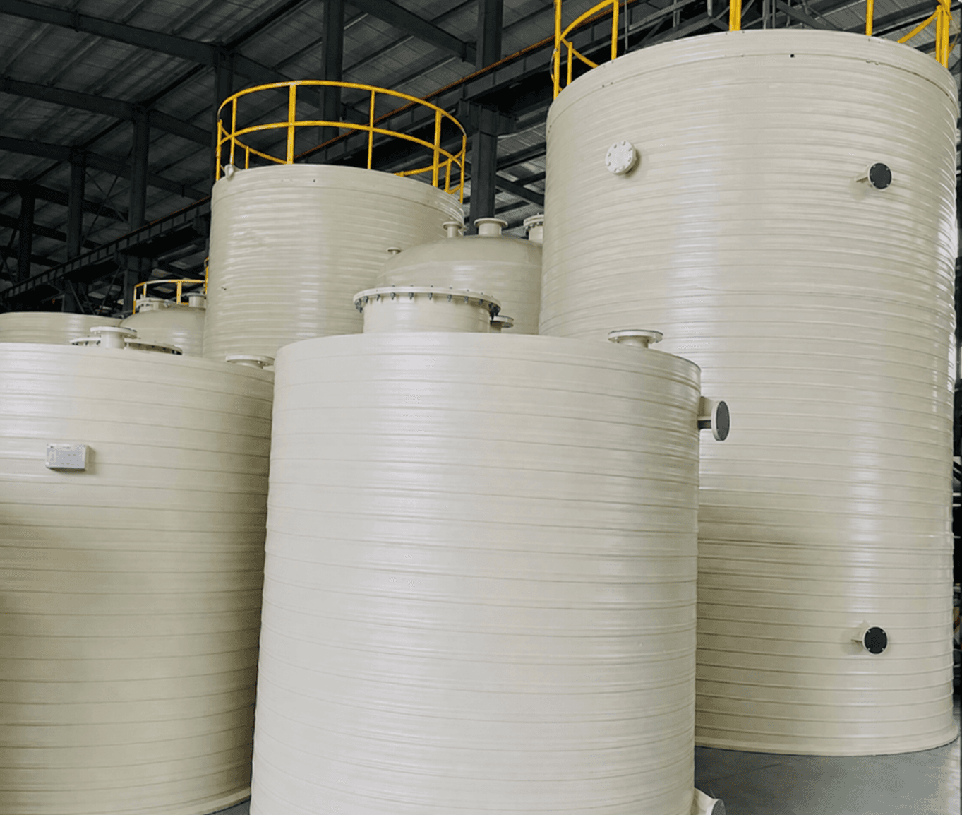 Fabricated corrosion-resistant storage tanks inside the manufacturing facility